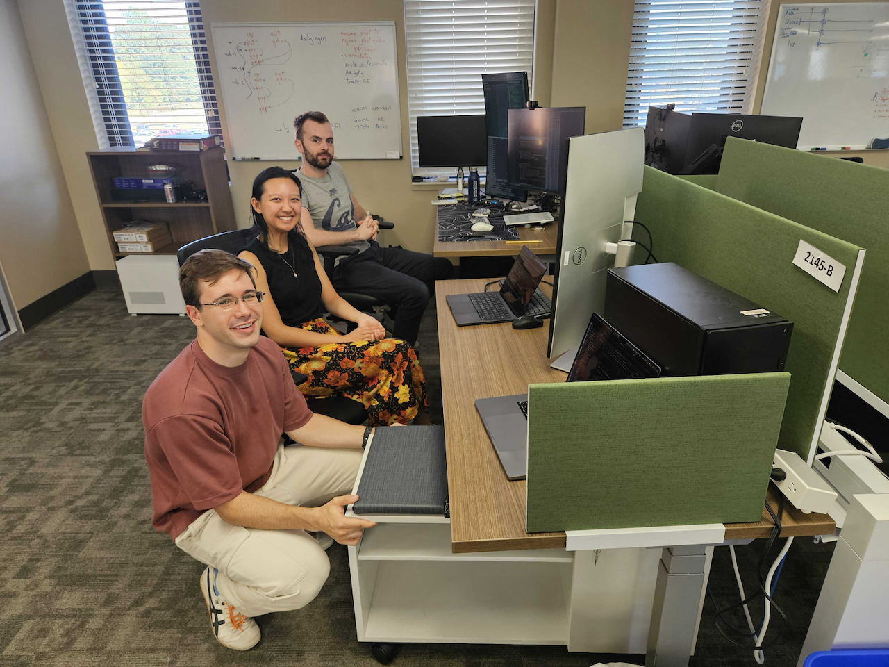 Josh Cunningham, Quinn Lee, and Leo Lonzarich deep in a debugging session